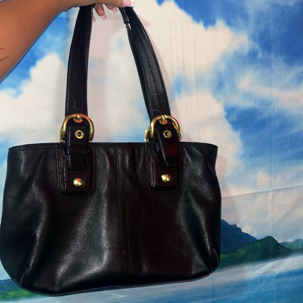 This is a Coach bag / hand or shoulder bag